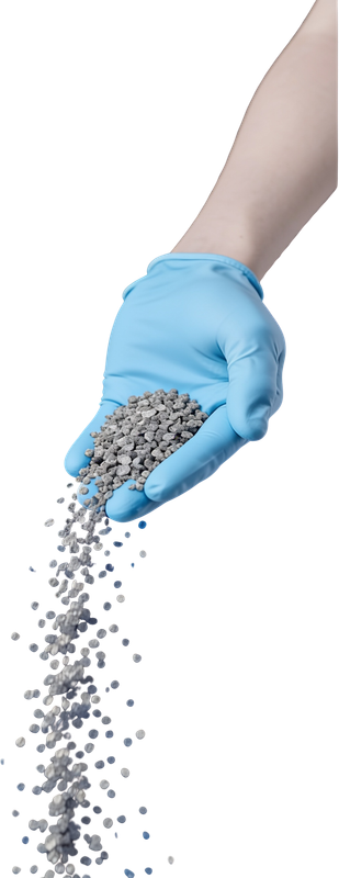 Gloved hand pouring recycled PCR granules
