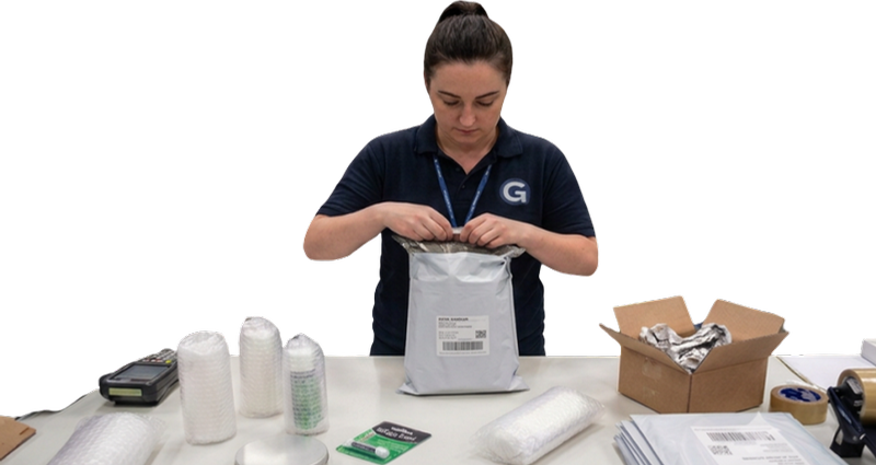 E-commerce packer sealing a courier mailer
